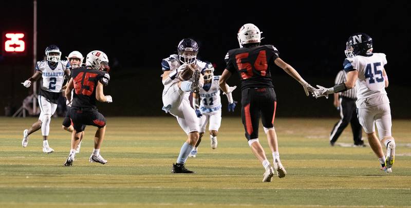 Nazareth Academy's Brendan Flanagan (9) intercepts a pass against Benet Academy during a football game at Benedictine University in Lisle on Friday, Oct 21, 2022.