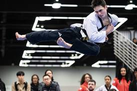 Michael Bols of Mazon medals in Team USA taekwondo competition