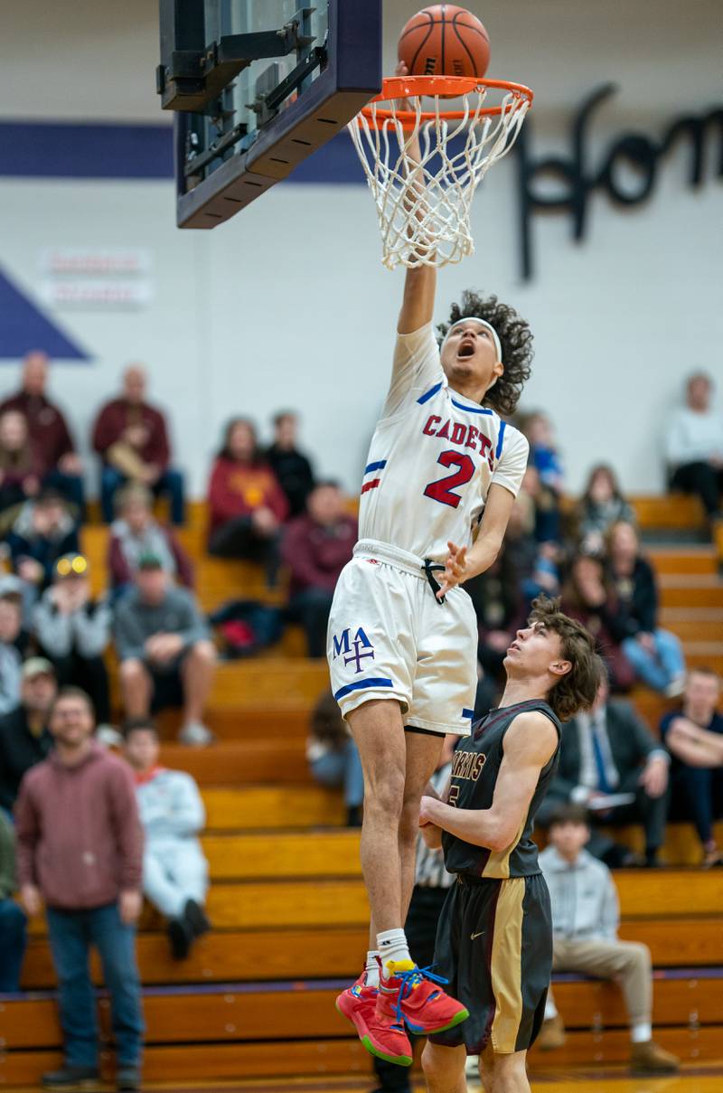 Marmion's Jabe Haith (2) goes up for a dunk against Morris during the 59th Annual Plano Christmas Classic basketball tournament at Plano High School on Tuesday, Dec 27, 2022.