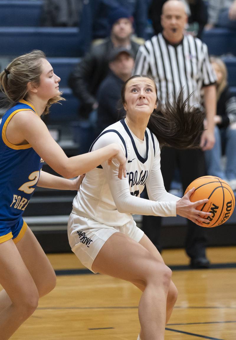 Cary-Grove's Sam Skerl looks to shoot under pressure from Lake Forest's Charlotte Axus during the Class 3A Cary-Grove Regional Girls Basketball Championship game on Thursday, February 20, 2025 in Cary. Ryan Rayburn for Shaw Local