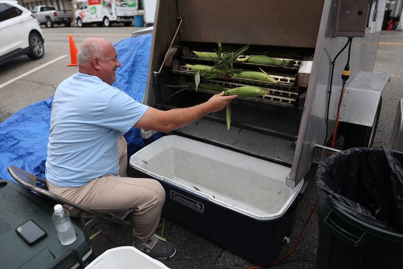 Steve Olson grills corn on the cob at the 75th Annual Grundy County Corn Festival on Saturday, Sept. 28, 2024 in downtown Morris.
