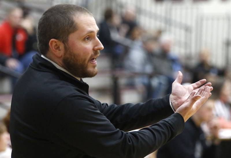 Prairie Ridge Head Coach Brian Frericks talks to his players during a IHSA Class 3A Burlington Central Regional quarterfinal boys basketball game against Illinois Math & Science Academy on Monday, feb23, 20256, at Prairie Ridge High School in Crystal Lake.