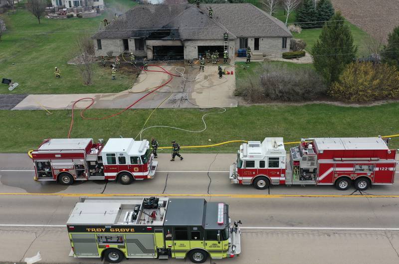 Firefighters work the scene of a structure fire in the 600 block of U.S. Route 6 on Tuesday, April 1, 2025 in La Salle. Fire departments from Peru, La Salle, Utica, Troy Grove, Wallace, Spring Valley and Oglesby were dispatched just before 2:30 to a one-story dublex home.