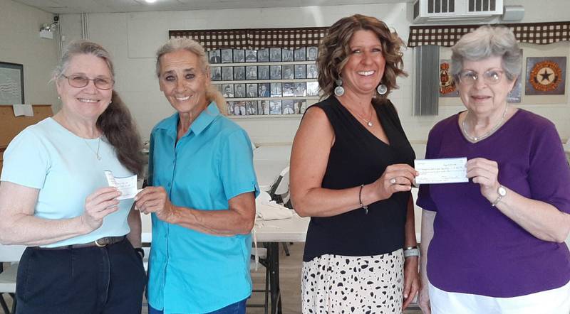 Raffle proceeds were presented by Terri Martin, Quilters Dozen treasurer, to Dottie Schwartz, Oswego American Legion manager, and to Cindy Benson, Oswegoland Park District representative, by Diana Schlosser, Quilters Dozen president.