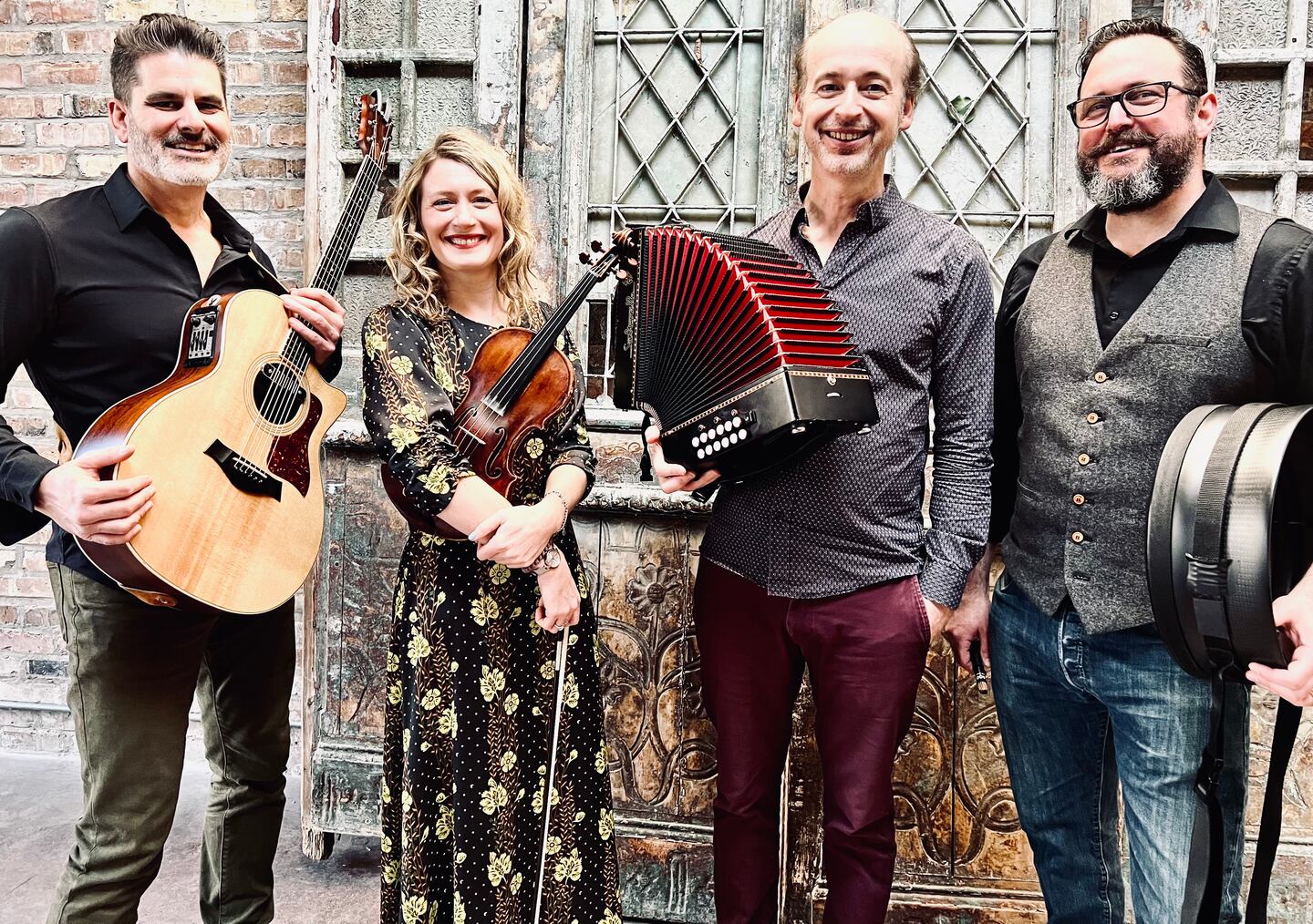 Steam Quartet from Rendezvous Arts includes  Jeff Lindblade on guitar, Katie Grennan on fiddle, John Williams on accordion and Steve Morrow on bodhran.