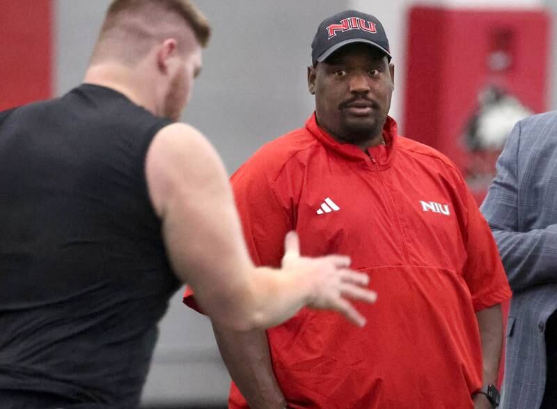 Northern Illinois University football head coach Thomas Hammock watches one of his former players run the 40-yard dash for NFL scouts during pro day Monday, March 17, 2025, in the Chessick Practice Center at NIU in DeKalb.