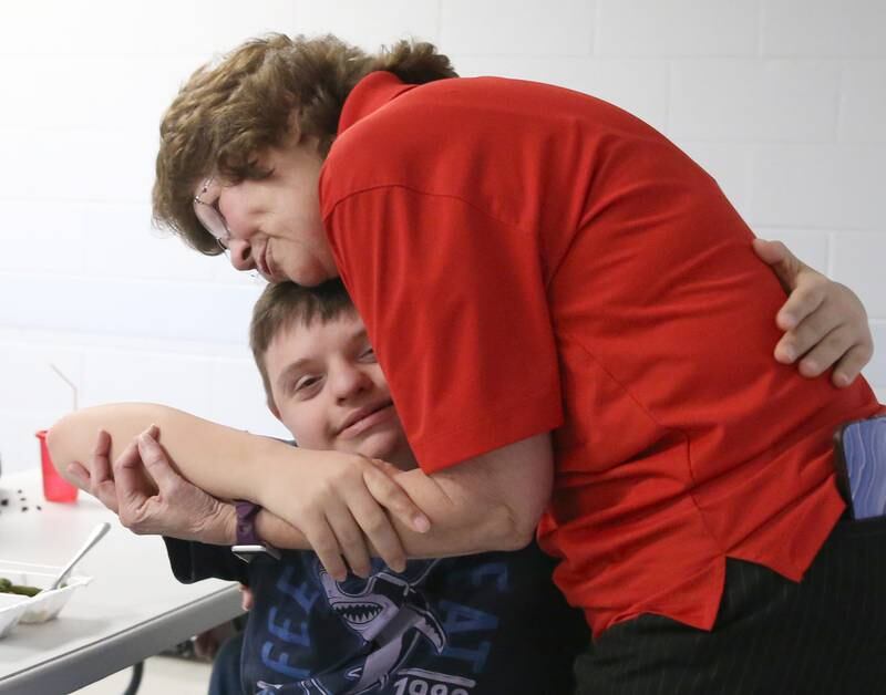 Lighted Way Executive Director Jessica Kreiser hugs a student on Monday, Jan. 23, 2023 in La Salle. Lighted Way will be moving this summer from their 10,000-square-foot center to a 33,000-square-foot center and will allow better programming and more activities.