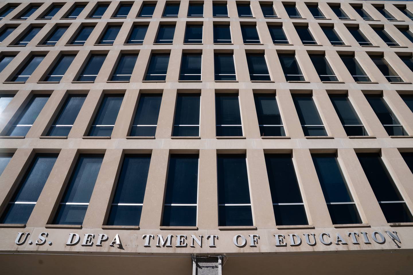 Letters on the Department of Education building are seen missing after removal of America 250 banners, which included those of Booker T. Washington, Catharine Beecher and Charlie Kirk, on Wednesday, March 18, 2026, in Washington.