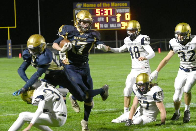 Polo's Brock Soltow gets a block and runs for a big gain during Friday action against Kirkland-Hiawatha.