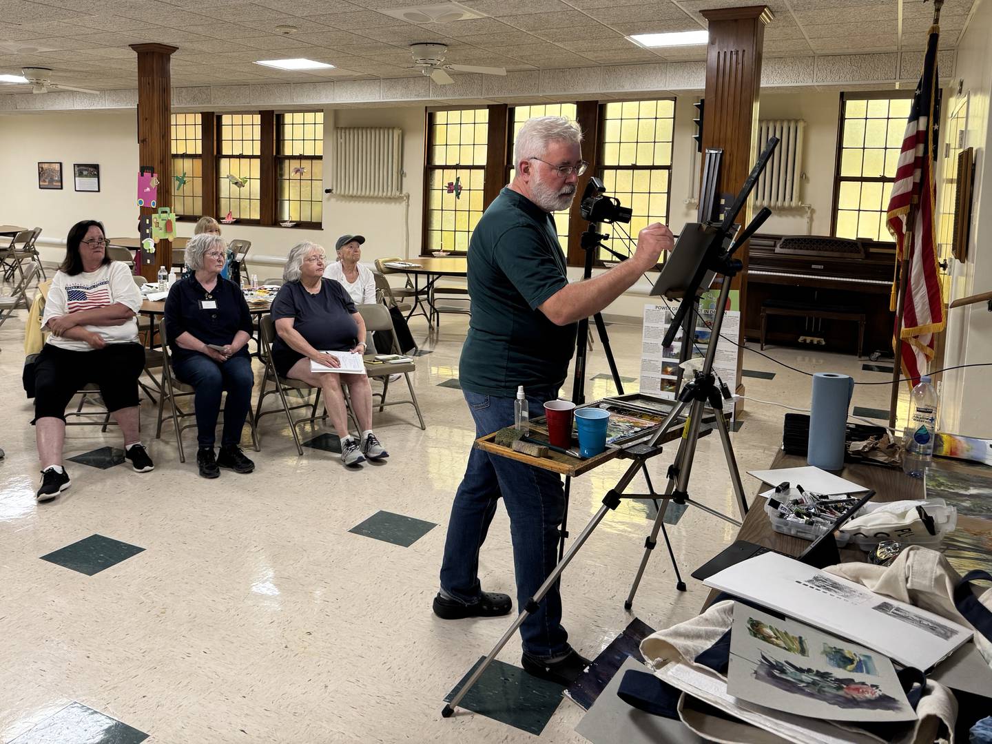 Artist Steve Puttrich demonstrates his process to the Morris Watercolor Guild on Saturday, June 14, 2025.
