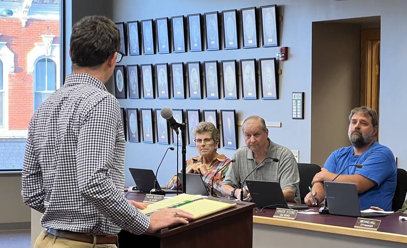 First Ward Alderpersons Alicia Cosky, Alan Bauer and Second Ward Alderperson Pete Paulsen listen as Menards real estate representative Patrick Wewel talks to Sycamore City Council on Sept. 18. Menard Inc. requested zoning map amendment to allow for the construction and operation of a self storage facility on the southwest corner of the intersection of Mercantile and Mediterranean Drives.