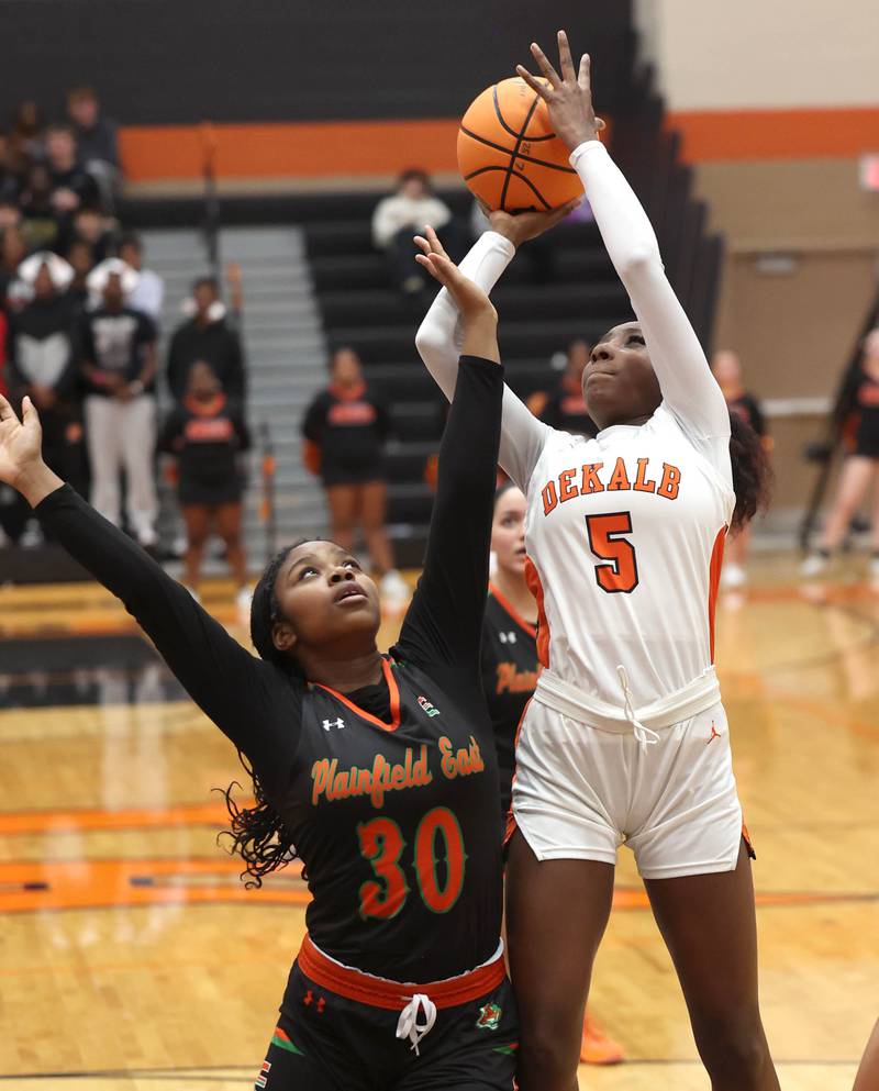 DeKalb's Me'She Eubanks shoots over Plainfield East's Emwanmwosa Osazuwa Thursday, Feb. 12, 2026, during their game at DeKalb High School.