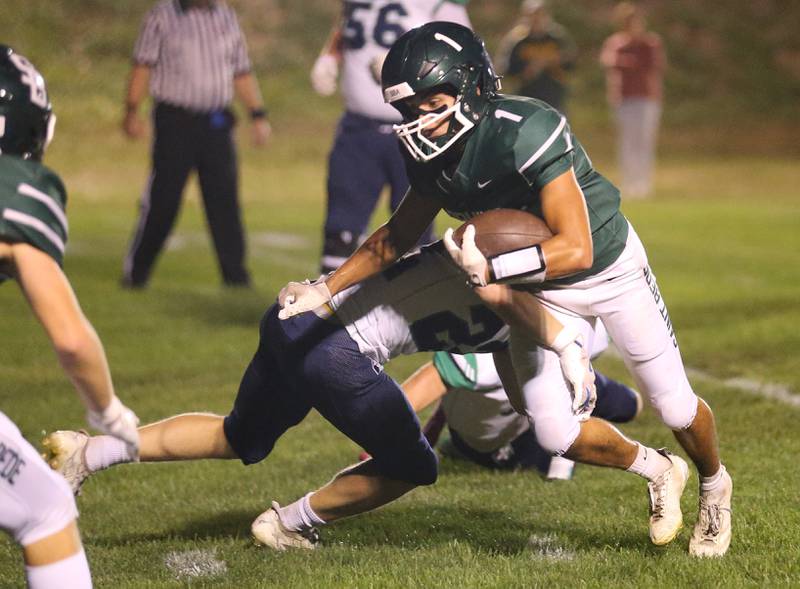 St. Bede's Jose De Le Torre fights for extra yards while playing Peoria Notre Dame on Friday, Oct. 17, 2025 at St. Bede Academy.