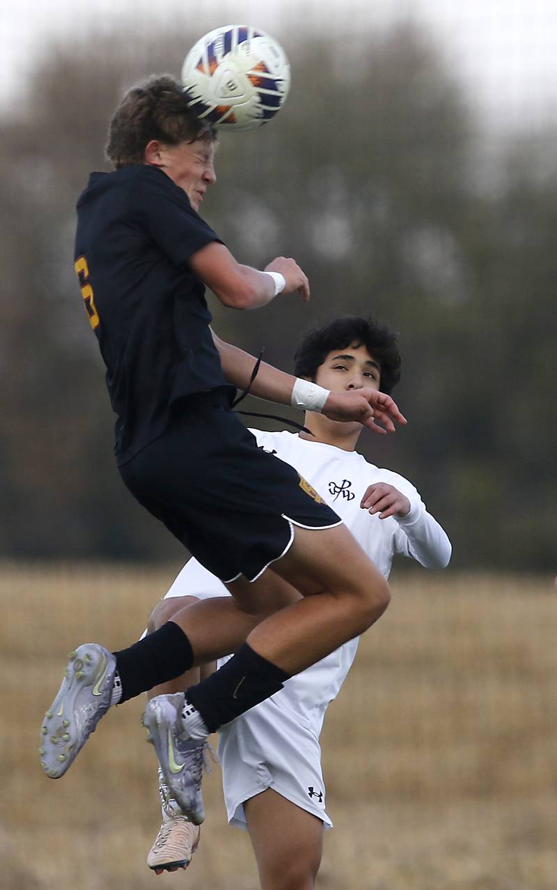 Richmond-Burton's Brayden Mumbower heads the ball away from F.W. Parker's Rohan Liew during an IHSA Class 1A Johnsburg Sectional semifinal match on Oct. 28, 2025, at Johnsburg High School.