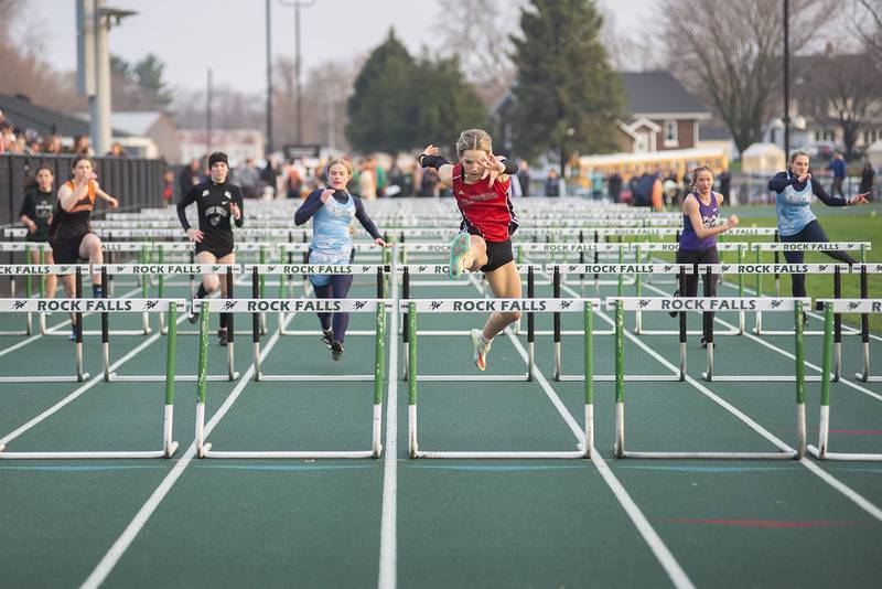 Amboy's Ellie Jones clears the final hurdle Friday, April 22, 2022 at the Rock Falls track invitational.