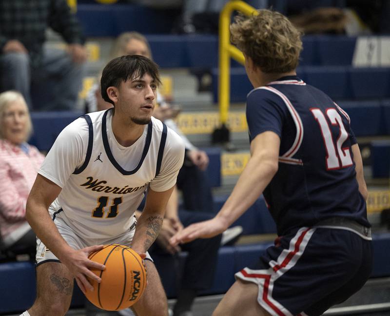 Sterling’s Nico Battaglia looks to make a play against St. Viator’s Jack Leonard Monday, Jan. 20, 2025, during Sterling’s MLK Classic.