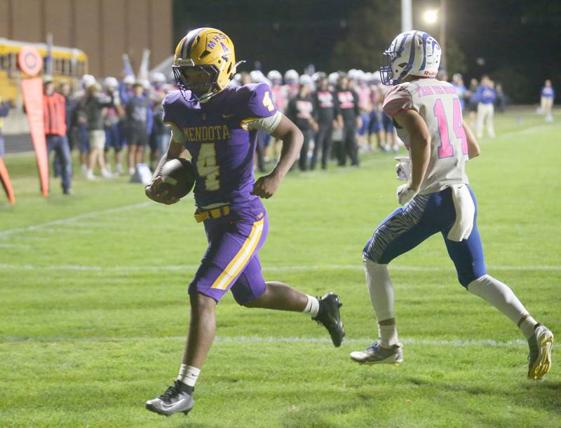 Mendota's Jayden Lesley runs in for a touchdown past Princeton's Jack Oester on Friday, Oct. 10, 2025 at Bryant Field in Princeton.