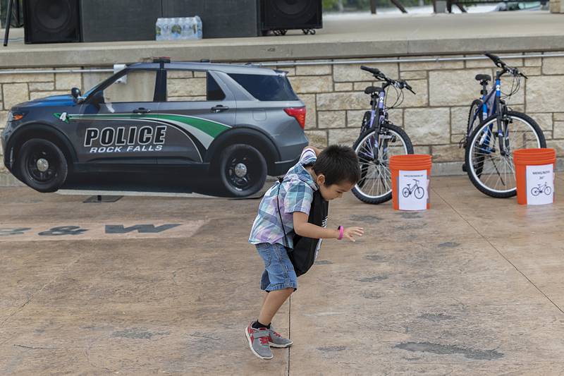 Emerson Kaecker, 4, dances to a DJ Tuesday, Aug. 6, 2024 during National Night Out in Rock Falls.