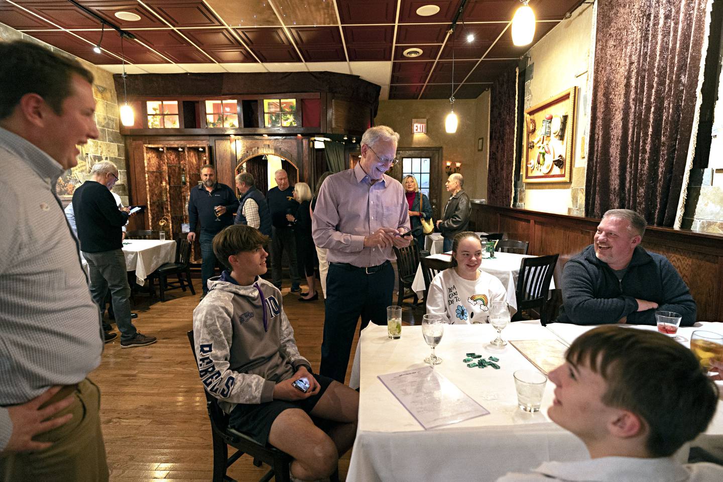Dixon mayor-elect Glen Hughes laughs with family and supports during his election party Tuesday, April 4, 2023 in Dixon.