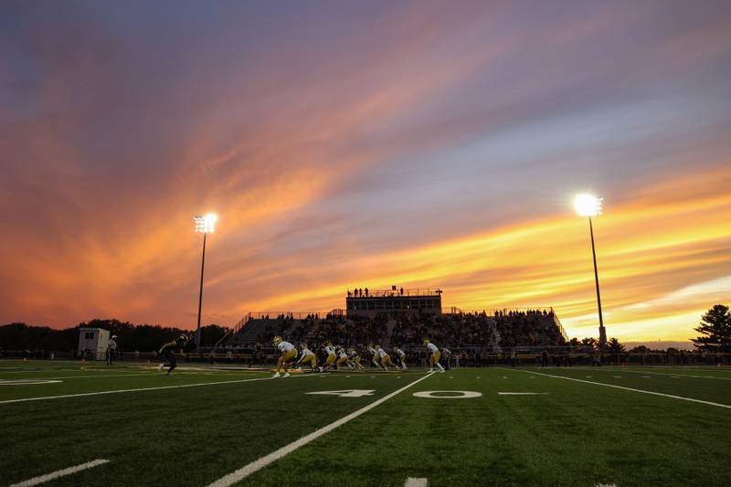 The sun sets behind Herscher's Seebach Stadium during the annual rivalry game against Bishop McNamara on Friday, Sept. 5, 2025. The Fightin' Irish would pull ahead to 45-28 victory over the Tigers in the fourth quarter.