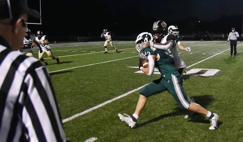 Grayslake Central’s Jonny Lindberg-Sage is tackled by Grayslake North’s Dominique Pulliam after intercepting the ball in a football game at Central High School on Thursday, September 14, 2023.