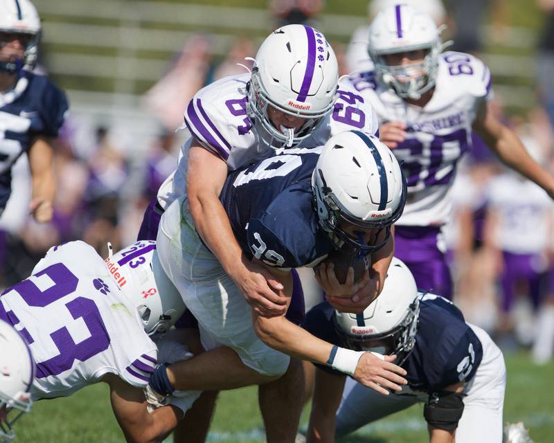 Hampshire's Carter Hintz tackles Cary Grove's Boone Holden on Saturday Oct. 5,2024 in Cary.