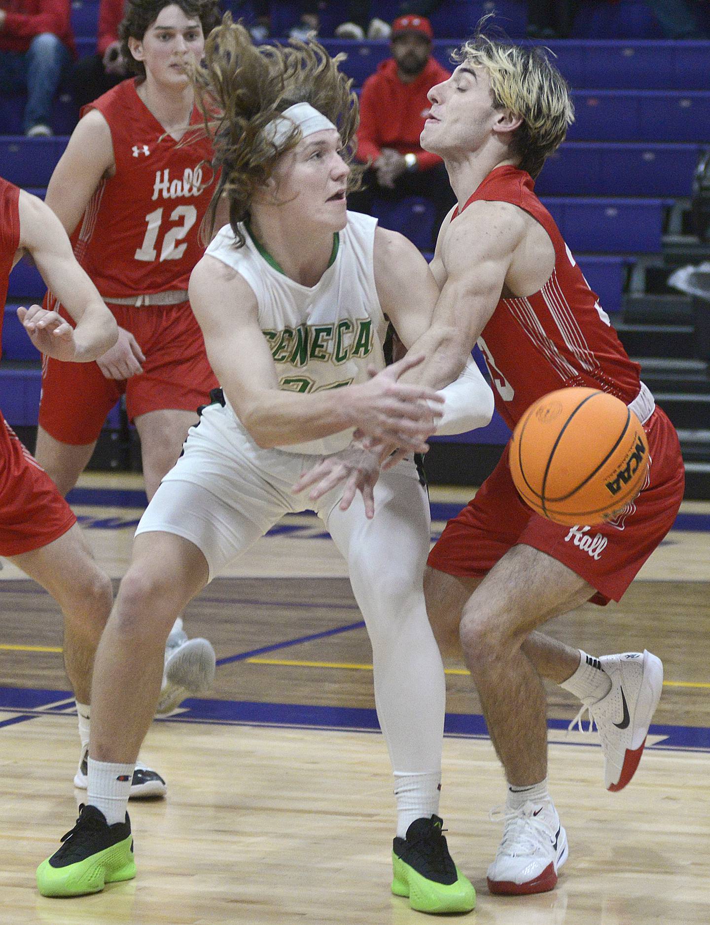 Seneca’s Grant Siegel gets this pass by Hall’s Braden Curran in the first period Monday at the Huskers Hardwood Tip-Off Tournament at Serena.