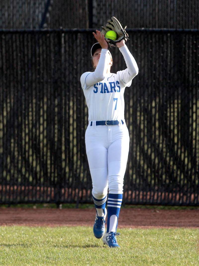 St. Charles North's Mackenzie Patterson makes a catch in center field during a game against Wheaton North on Tuesday, April 15, 2025 in St. Charles.