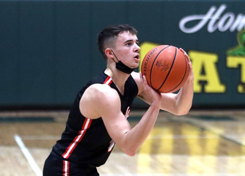 Huntley’s Ben Ahmer plays for the Red Raiders in boys varsity basketball at Crystal Lake South Friday night.