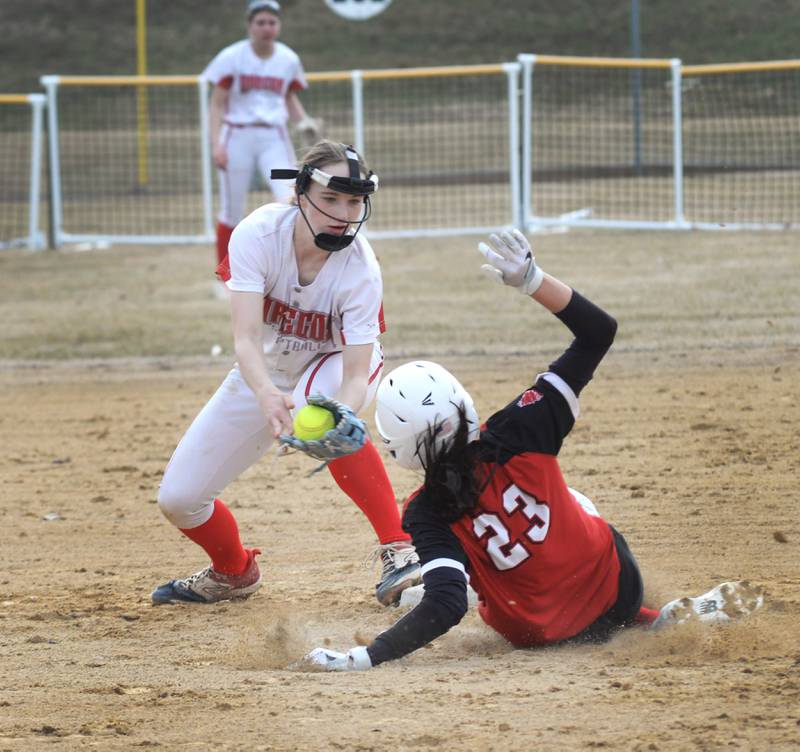 Oregon shortstop Ella Dannhorn looks to tag Amboy's Tyrah Vaessen as she slides safely into to  second base on Tuesday, March 18, 2025 at Oregon Park West.