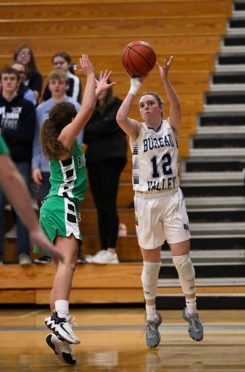 Bureau Valley's Kate Stoller shoots over Rock Falls' Elizabeth Lombardo in Saturday's regional game at the Storm Cellar.