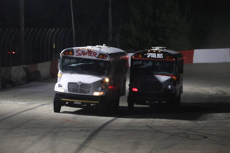 The Sawyer and the Spool Bus go head to head in a school bus race on a special fundraising night for the Special Olympics at Grundy County Speedway on June 15, 2024 in Morris.