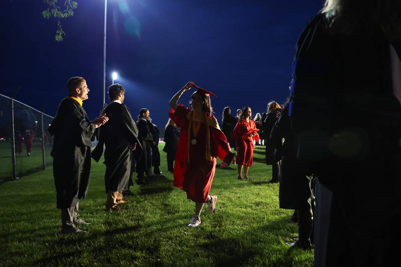 Graduate Sophia Brandenburg leaves the stadium through a tunnel of teachers and faculty following the Bradley-Bourbonnais Community High School commencement ceremony on Thursday, May 21, 2026.