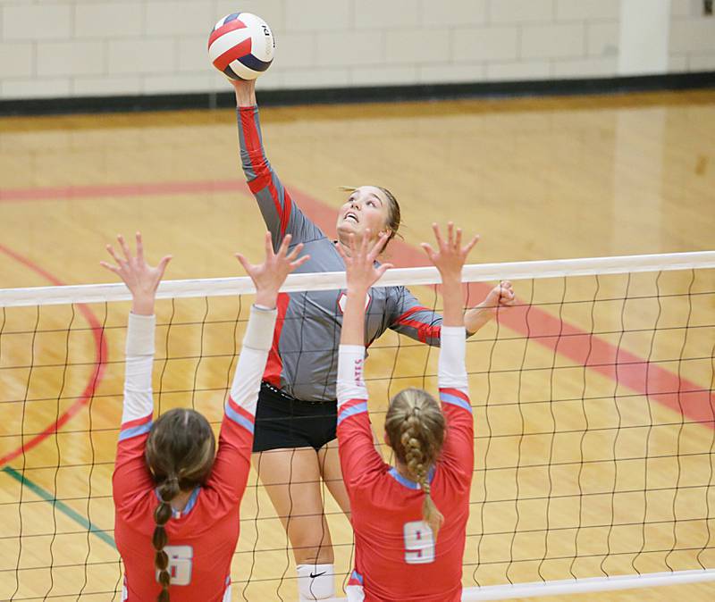 La Salle-Peru's Emma Garretson (5) delivers a kill past Ottawa's Mel Pries (6) and teammate Skyler Dorsey (9) on Thursday, Sept. 22, 2022, at A.J. Sellett Gymnasium.