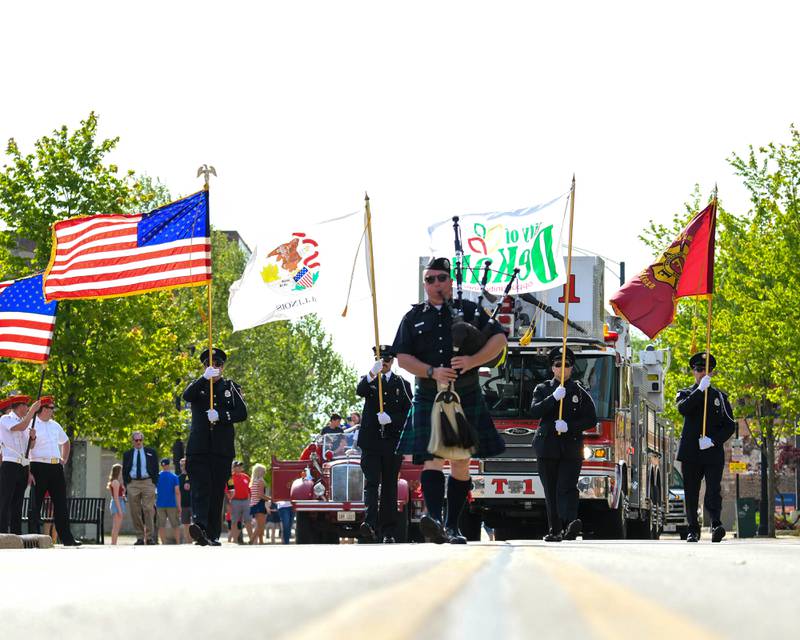 Tom Conley of DeKalb leads the Memorial Day parade with his bagpipes through downtown DeKalb on Monday, May 30, 2022.