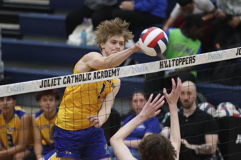 Joliet Central’s Logan Wright powers a shot against Joliet Catholic on Wednesday, April 1, 2026 in Joliet.