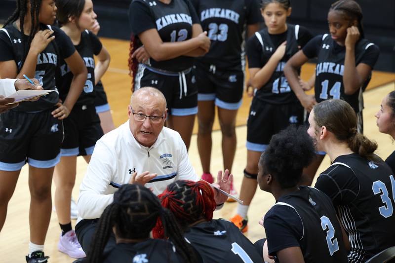 Kankakee's Kurt Weigt talks to the team between quarters during the Kays' 75-28 victory over Rosary at the Reed-Custer Classic on Monday, Nov. 17, 2025.