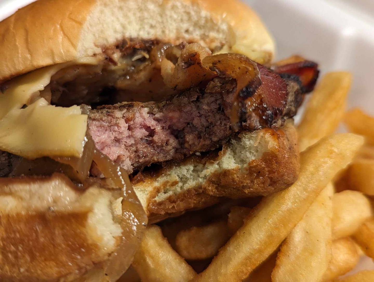 The backroad burger at Backroads Burger & Bar in Plainfield came with smoked gouda, pulled pork, applewood bacon, sautéed onions and house-made barbecue sauce. The burger was cooked perfectly to order.