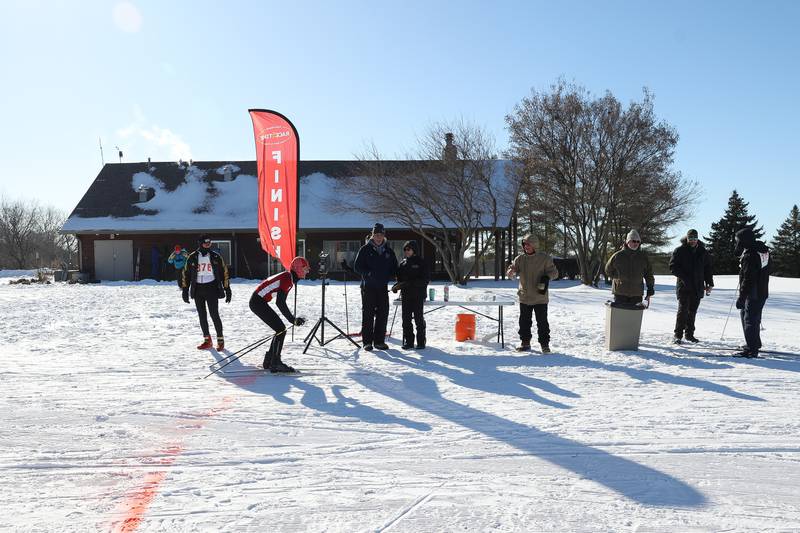 A skier crosses the finish line in the Joliet Nordic Ski Club 12k race on Saturday, Jan. 20th, 2024 at Woodruff Golf Course in Joliet.