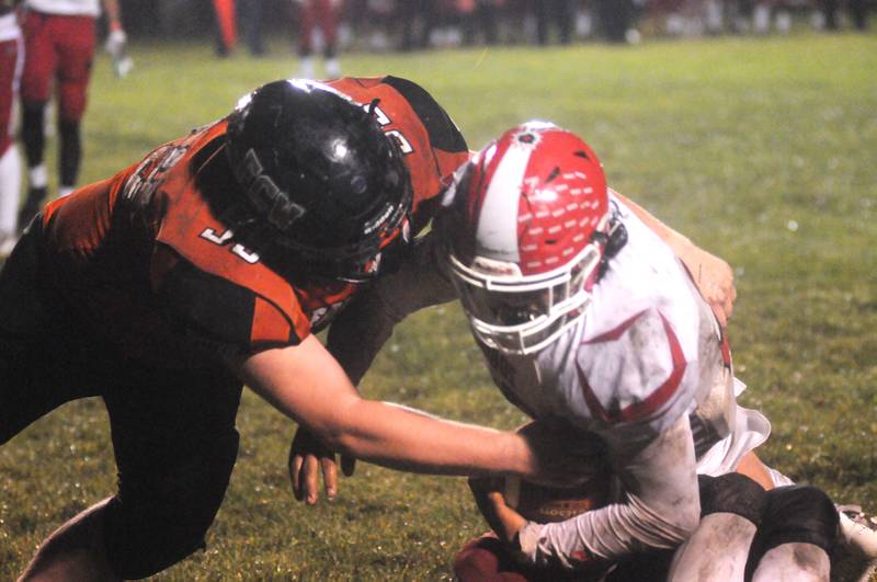 FCW's Joey Jones (59) tackles South Beloit ballcarrier Fernando Balderas at Woodland during an I8FA playoff game Friday, Oct. 29, 2021. Jones is one of a number of Times All-Area performers gone to graduation this fall's Falcons will be looking to replace.