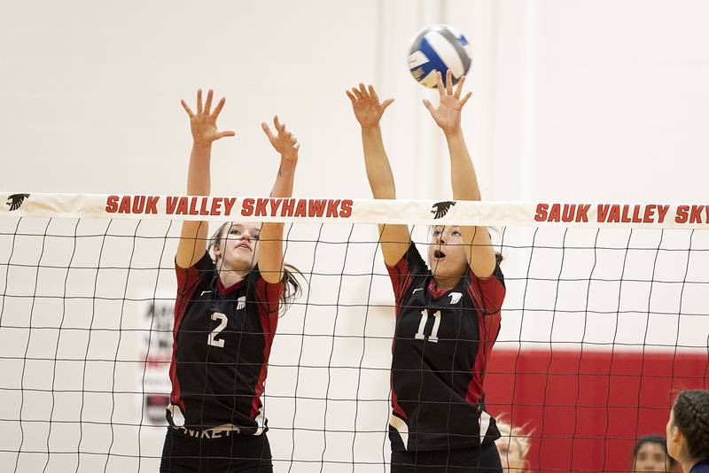 Sauk Valley’s Tiana Tichler (left) and Maya Gartin go up to block a shot Tuesday, Oct. 18, 2022 against Carl Sandburg College.