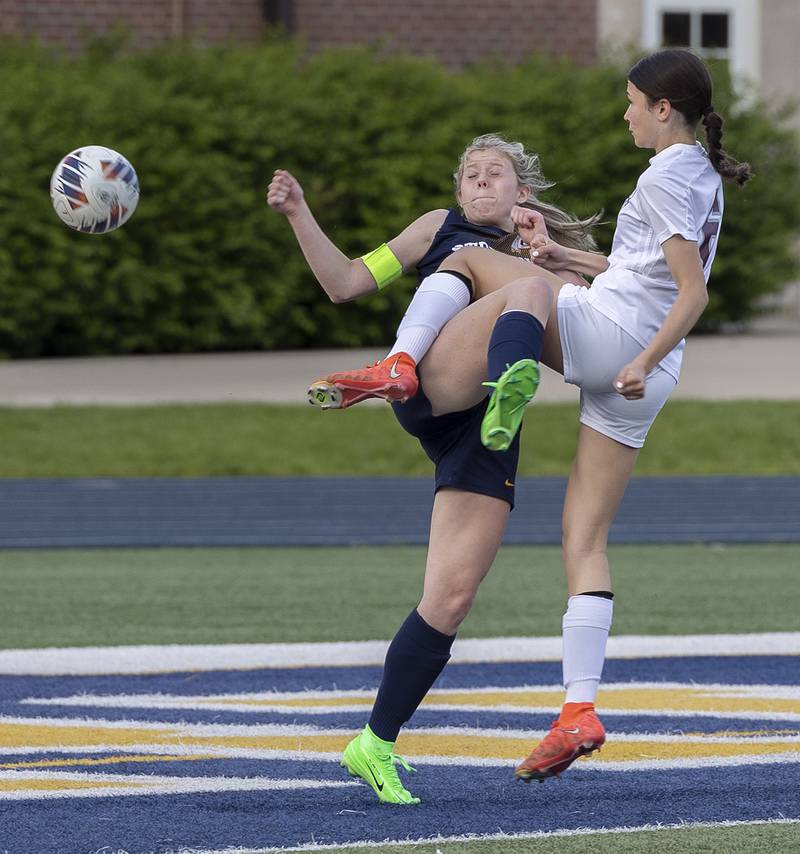 Sterling’s Lelaina Block and Moline’s Emma Rangel get tangled up in front of the goal Tuesday, April 30, 2024 at Sterling High School.