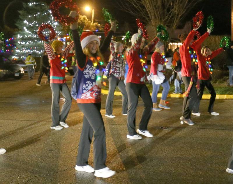 Princeton High School cheerleaders march in the inaugural Lighted Christmas Parade on Friday, Dec. 1, 2023 in Princeton.
