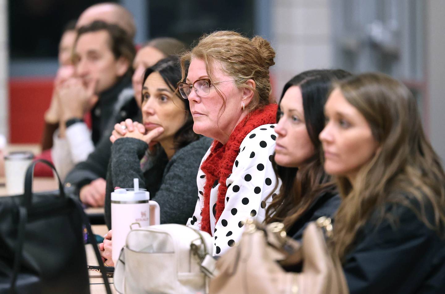 Attendees listen to Sycamore Community School District 427 Superintendent Steve Wilder speak Monday, Jan. 9, 2023, during a public meeting hosted by the district at North Grove Elementary School. The forum was held to get staff and community feedback on a plan that could change the district boundaries causing some students to have to switch elementary schools inside the district as early as next year.