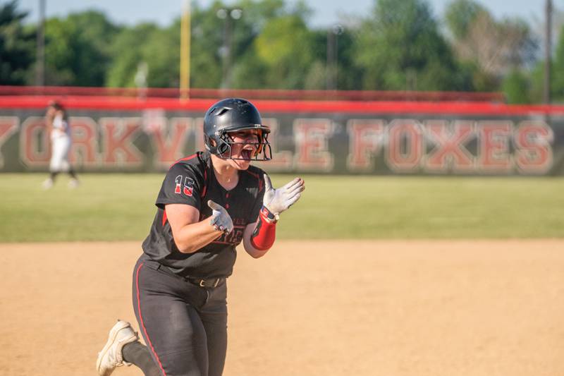 Yorkville's Regan Bishop (15) smiles after hitting a homer against Plainfield North during the Class 4A Yorkville Regional softball final at Yorkville High School on Friday, May 26, 2023.
