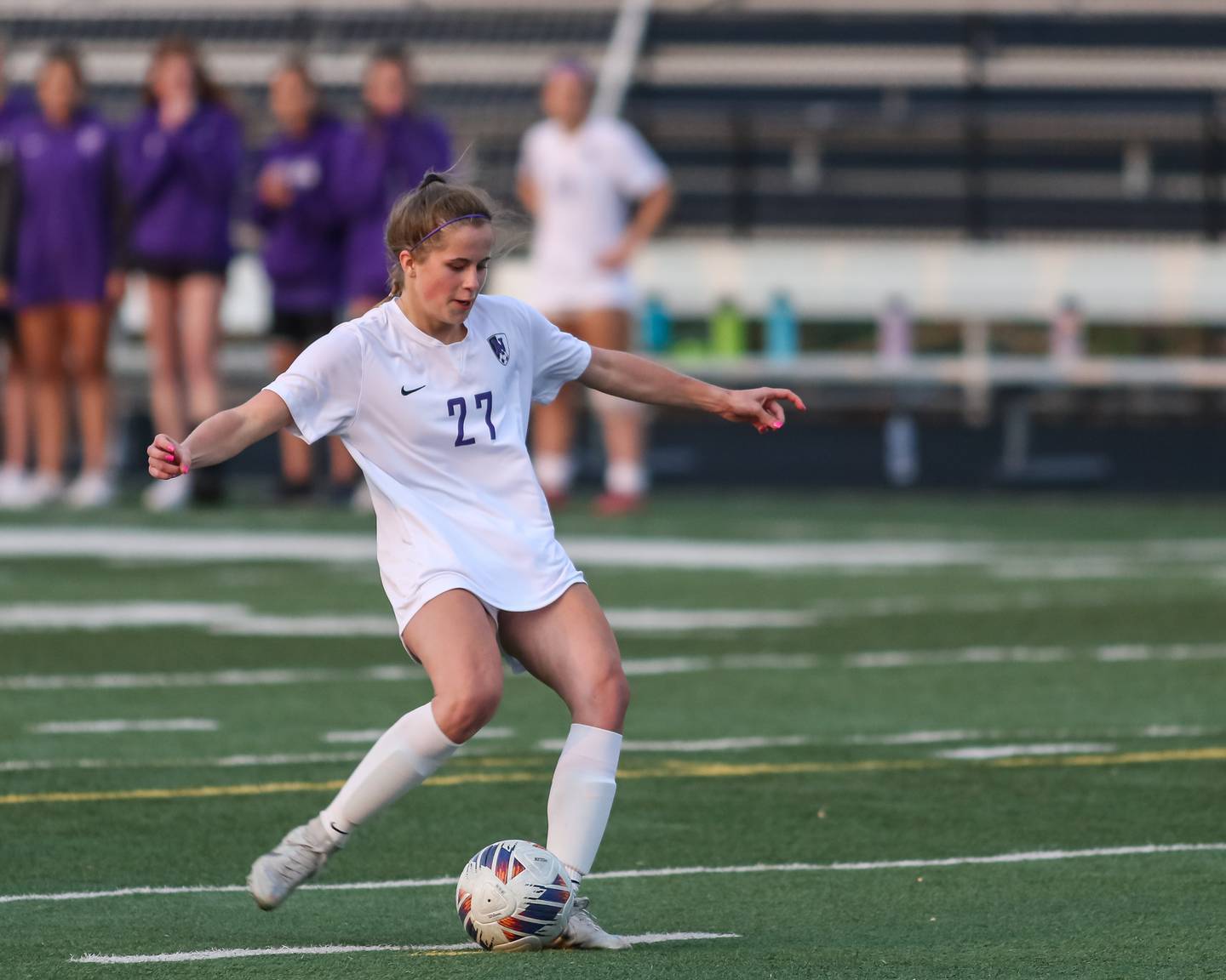 Downers Grove North's Lexi Keown (27) winds up for her penalty kick during Class 3A Addison Trail Regional final soccer match between Downers Grove South at Downers Grove North.  May 19, 2023.