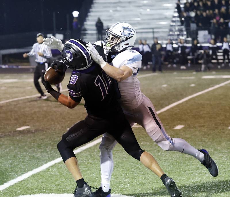 Downers Grove North's Oliver Thulin  (10) pulls in a long pass over Prospect's Will Fidler (8) during the IHSA Class 7A playoff football game Friday, Oct. 31, 2025 in Downers Grove.
