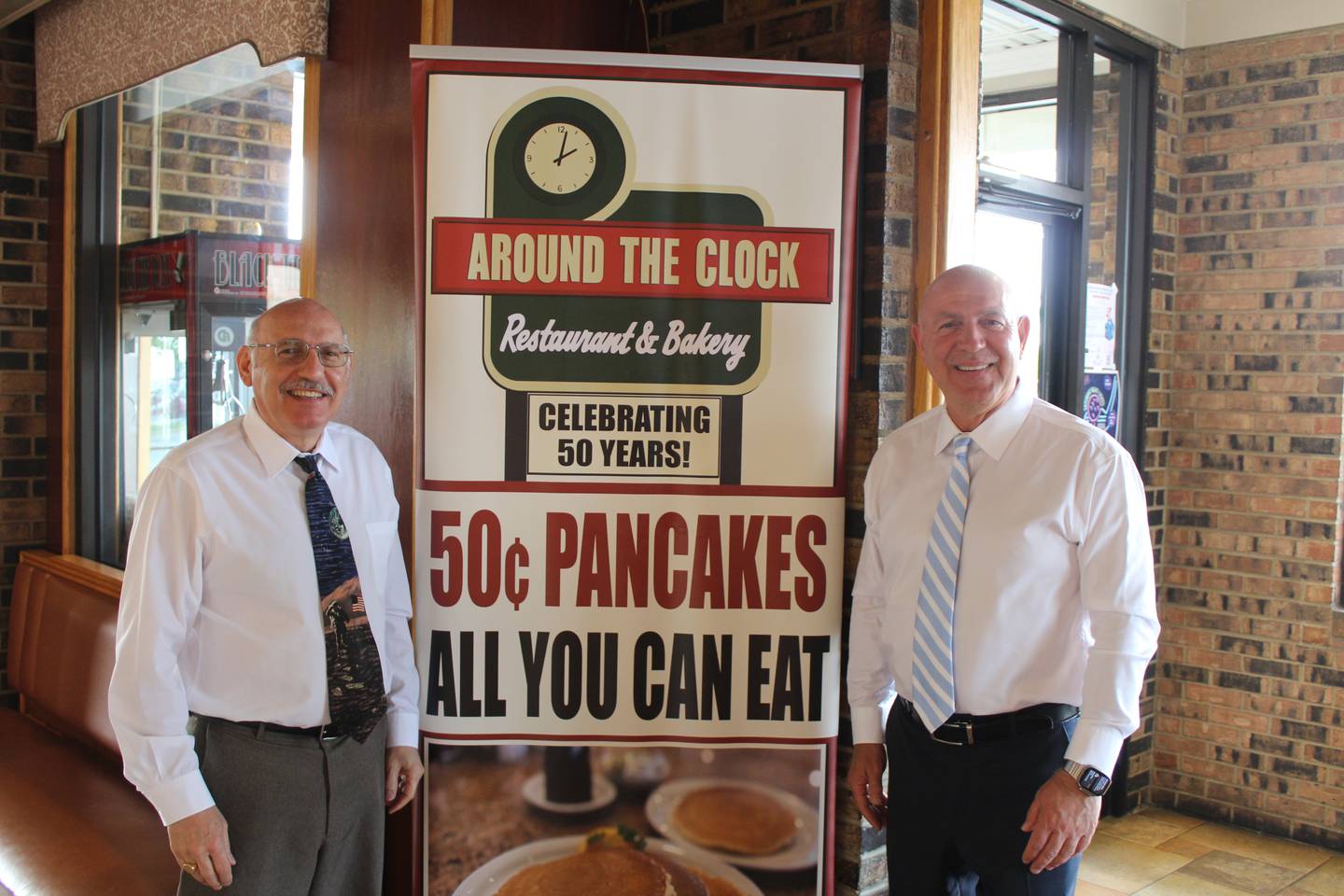 Brothers and Around the Clock co-owners Fano and Steve Thefanous, from left to right, celebrate the Crystal Lake diner's 50th anniversary.