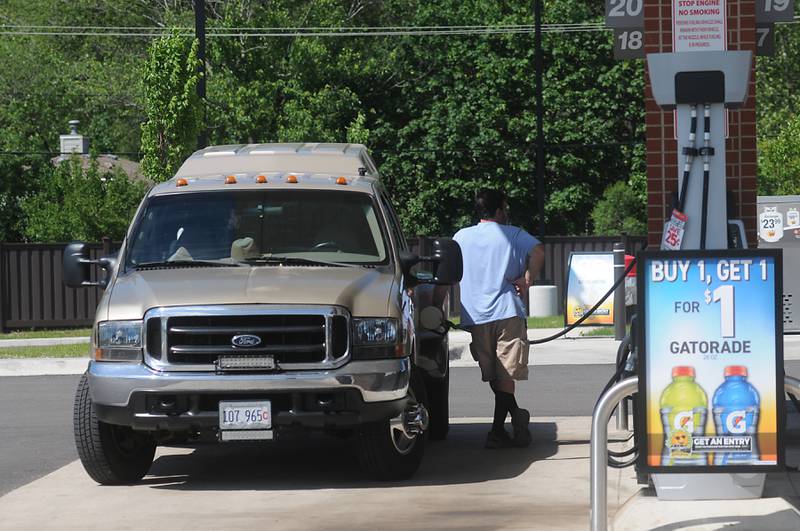 A man fuels his truck on Thursday, June 2, 2022, at the Thorntons gas station at the intersection of Chapel Hill Road and Route 120 in McHenry. Fuel prices reached a new high this week.