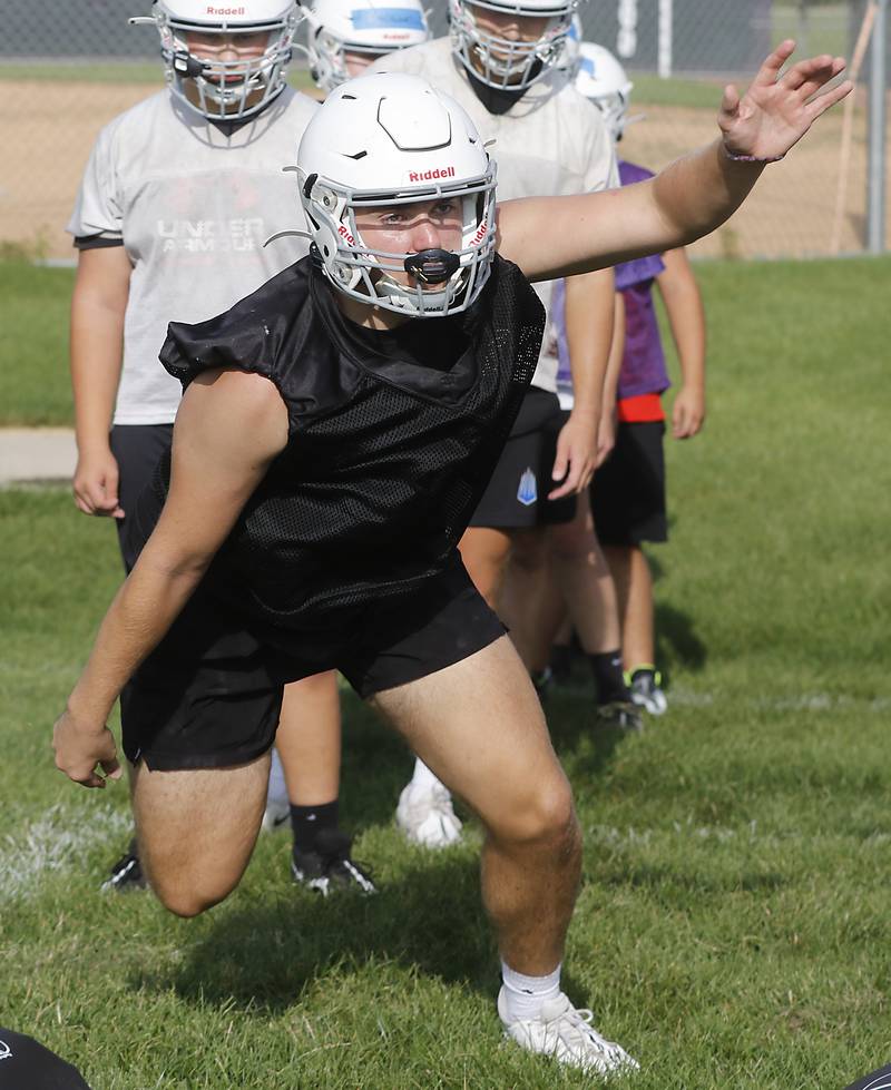 Hampshire’s Collin Kallhoff takes part in a blocking drill during the first day of football practice Monday, August 7, 2023, at the Hampshire High School.